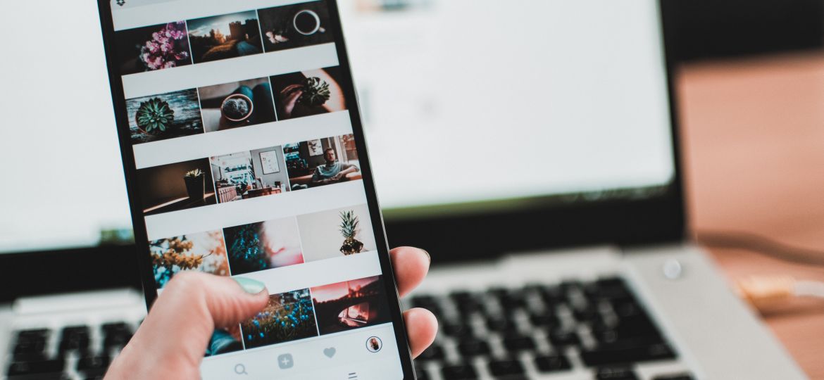 person on instagram holding a black phone